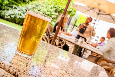 Iamge of beer on top of table in outdoor patio area