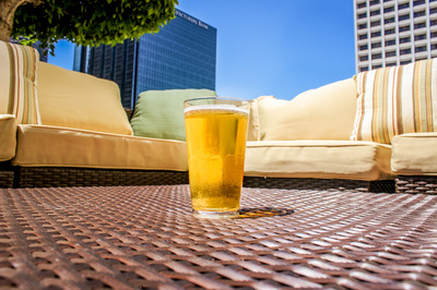 Iamge of beer on top of table in outdoor patio area